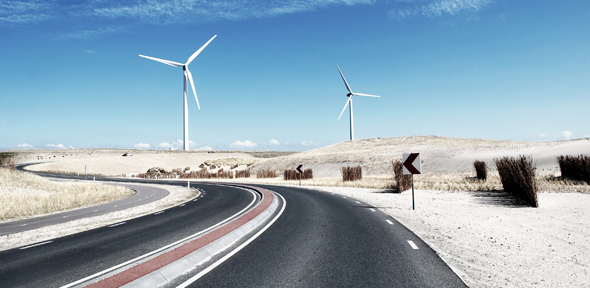 Open road and wind turbines